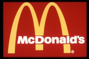 A picture of McDonald’s symbol in 1975 featuring a red and yellow color palette