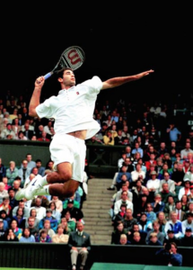 Pete Sampras performing his iconic jumpsmash move at the 1990 Wimbledon